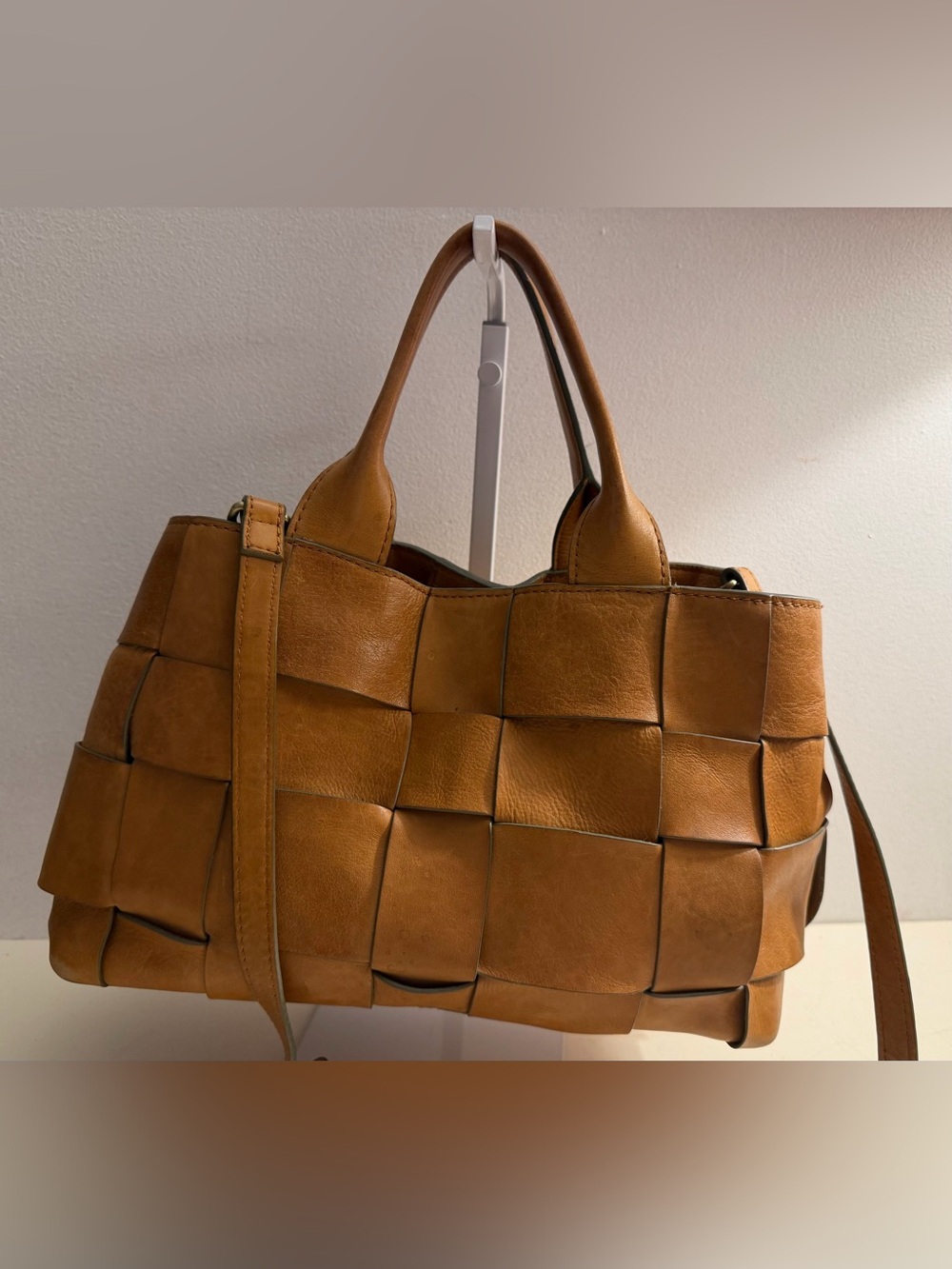 Leather satchel with wide basket weave design and crossbody strap. (Unbranded)
